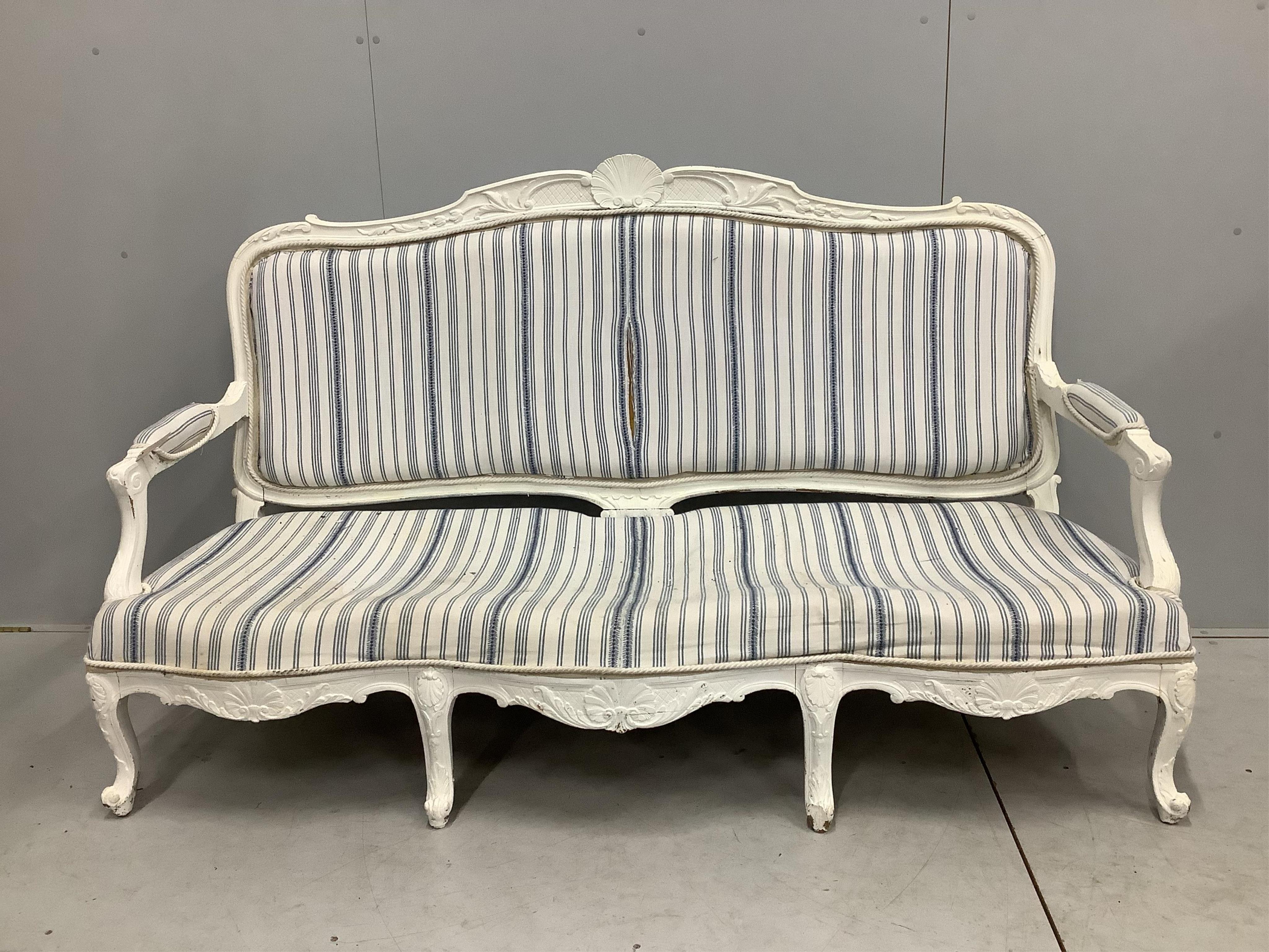 A Louis XVI style painted upholstered settee, width 180cm, depth 66cm, height 98cm. Condition - fair, upholstery poor